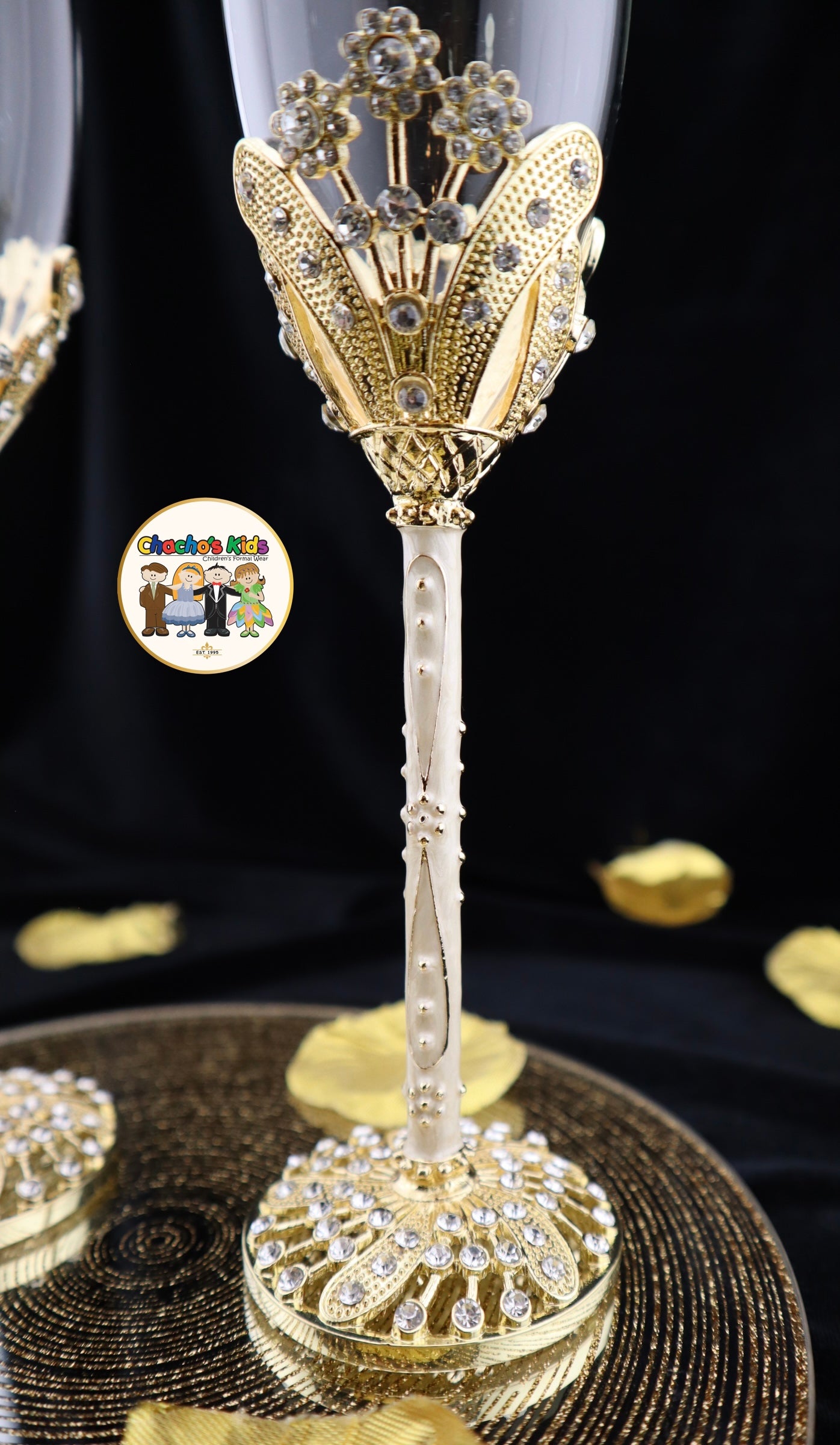 Decorative Wedding wine glass with intricate gold and silver design on a black background