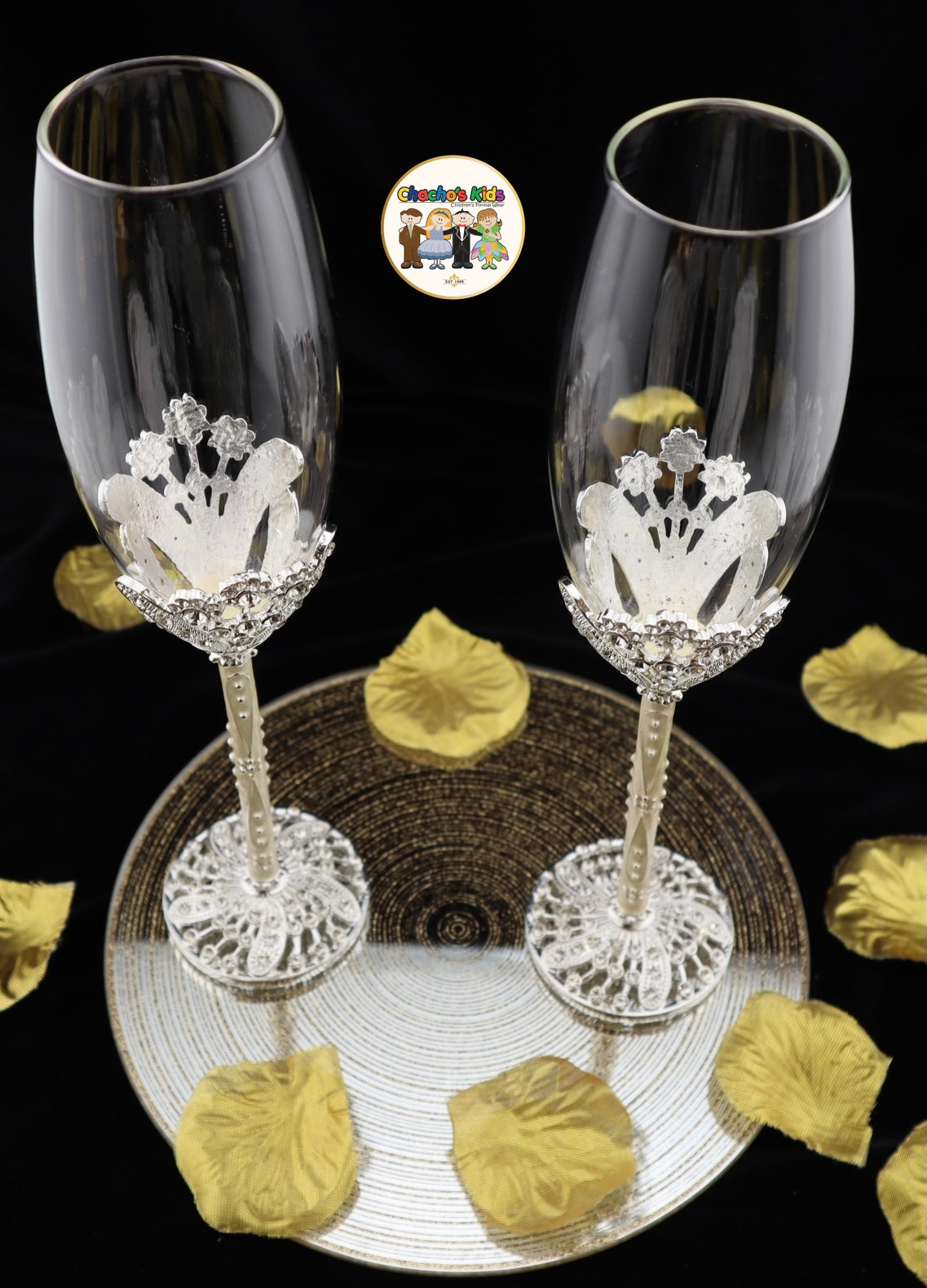 Two decorative Wedding wine glasses with crowns on a black background