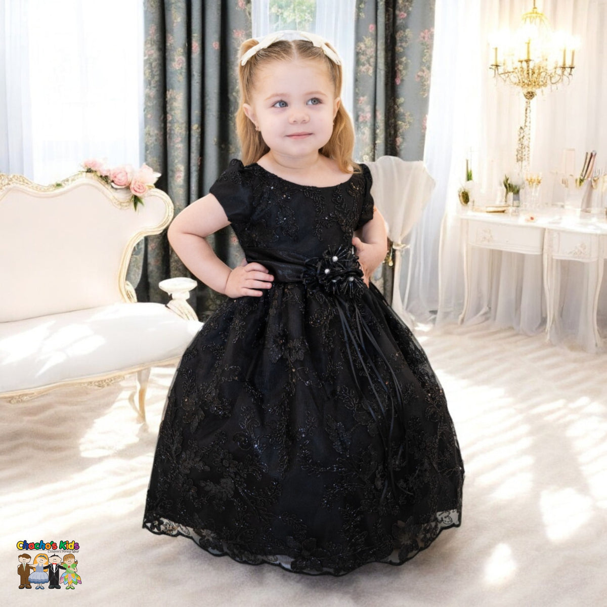 Embroidered flower girl dress on mannequin with cap sleeves and full skirt