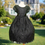 Black embroidered flower girl dress with satin bow, cap sleeves and full tulle skirt