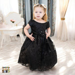 Embroidered flower girl dress showing full tulle skirt, floral details and satin waistband