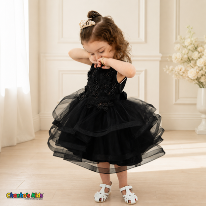 Black 9149B baby flower girl dress with pearl butterfly bodice and layered tulle, looking-down model pose