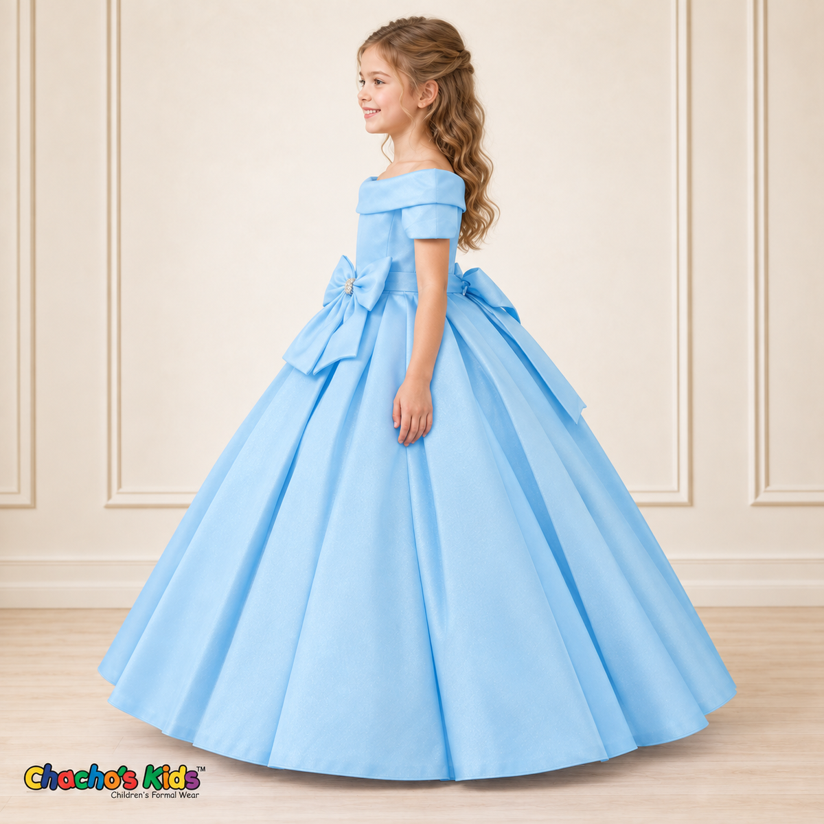 Baby Blue ball gown dress, style 9177, left-facing side view on a child model with a folded neckline, jeweled waist bow and full floor-length skirt.
