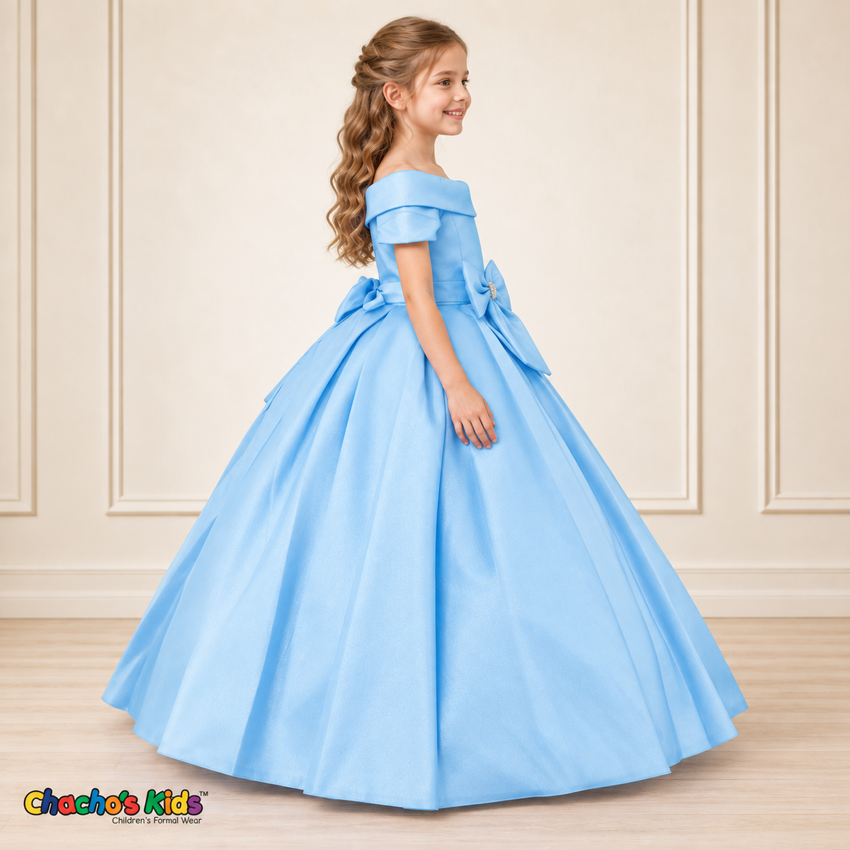 Baby Blue ball gown dress, style 9177, right-facing side view on a child model with a folded neckline, jeweled waist bow and full floor-length skirt.