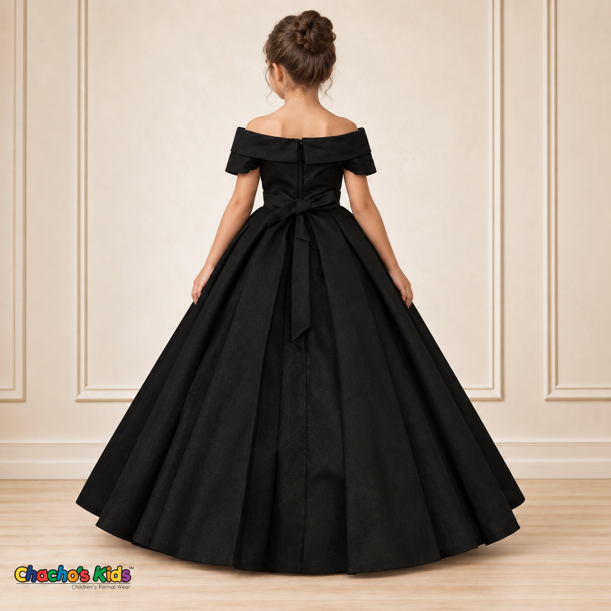 Black ball gown dress, style 9177, back view on a child model with a back zipper, tied waist sash and full floor-length skirt.