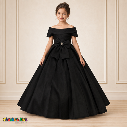 Black ball gown dress, style 9177, front view on a child model with a folded neckline, jeweled waist bow and full floor-length skirt.