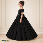 Black ball gown dress, style 9177, left-facing side view on a child model with a folded neckline, jeweled waist bow and full floor-length skirt.