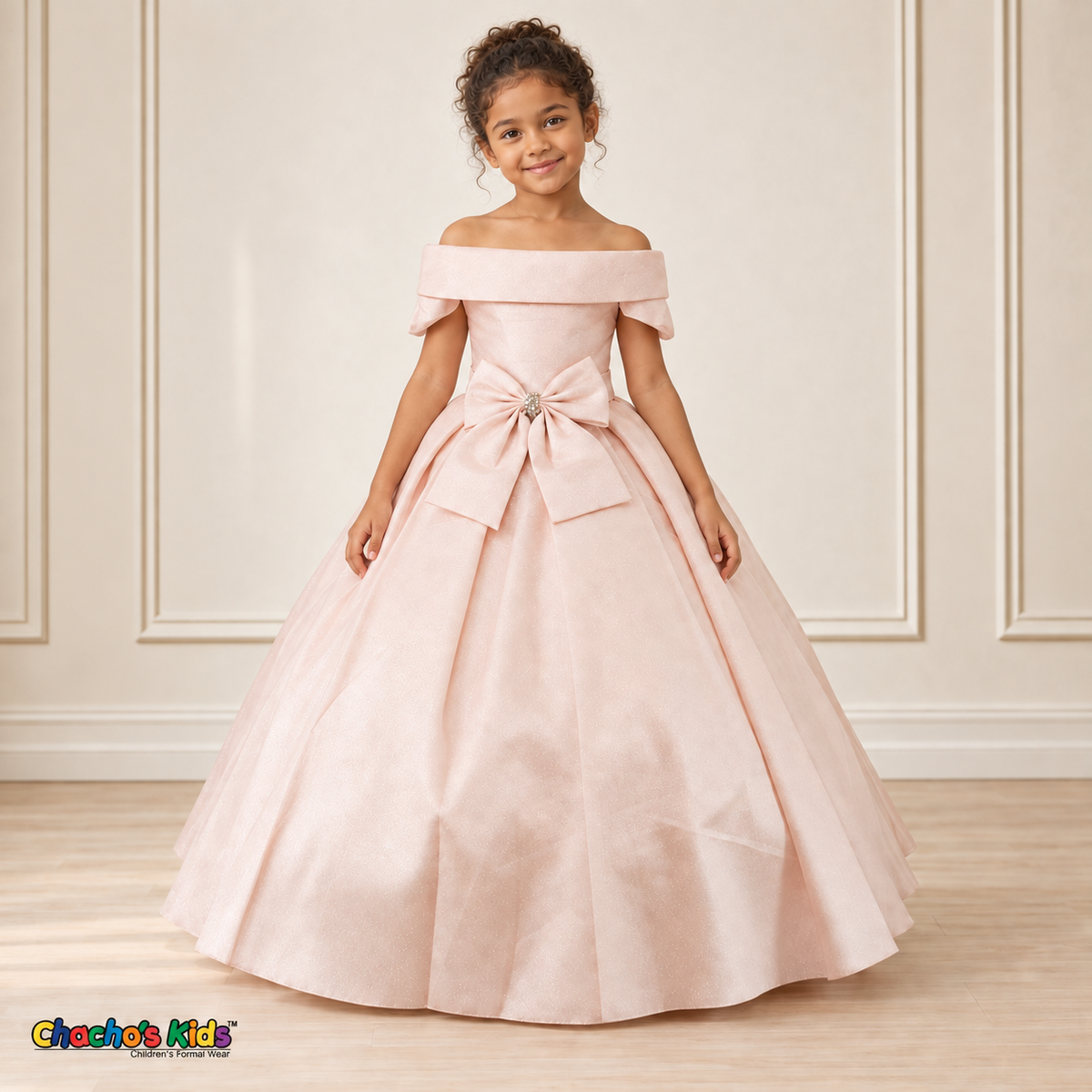 Blush ball gown dress, style 9177, alternate front pose on a child model with a folded neckline, jeweled waist bow and full floor-length skirt.
