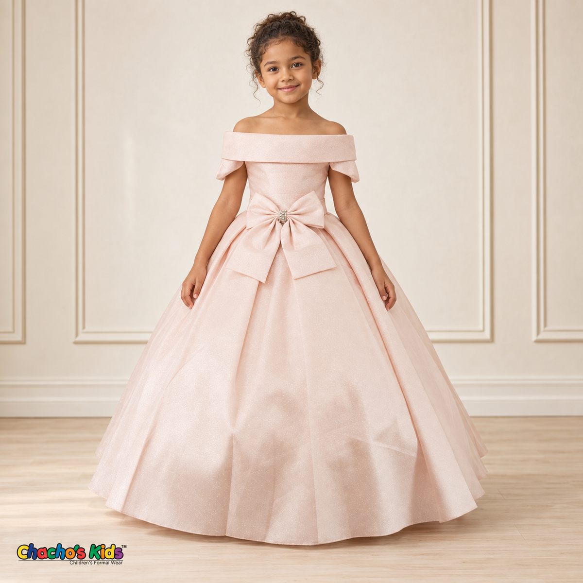 Blush ball gown dress, style 9177, front view on a child model with a folded neckline, jeweled waist bow and full floor-length skirt.