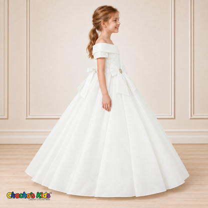 White ball gown dress, style 9177, right-facing side view on a child model with a folded neckline, jeweled waist bow and full floor-length skirt.