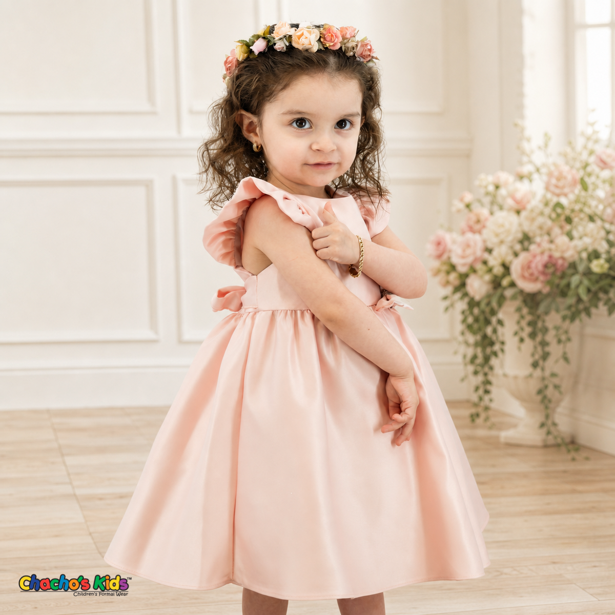 Blush B263 baby satin flower girl dress, three-quarter model view showing flutter sleeves