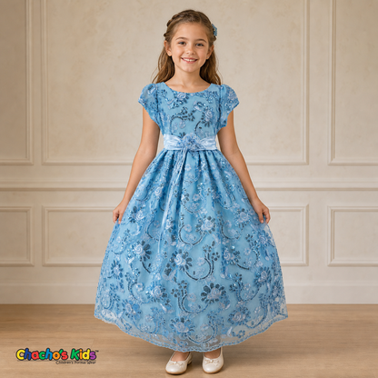 Girl wearing baby blue embroidered flower girl dress with satin bow, cap sleeves and full tulle skirt