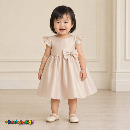 Baby girl wearing champagne satin flower girl dress with flutter sleeves and bow, style B263
