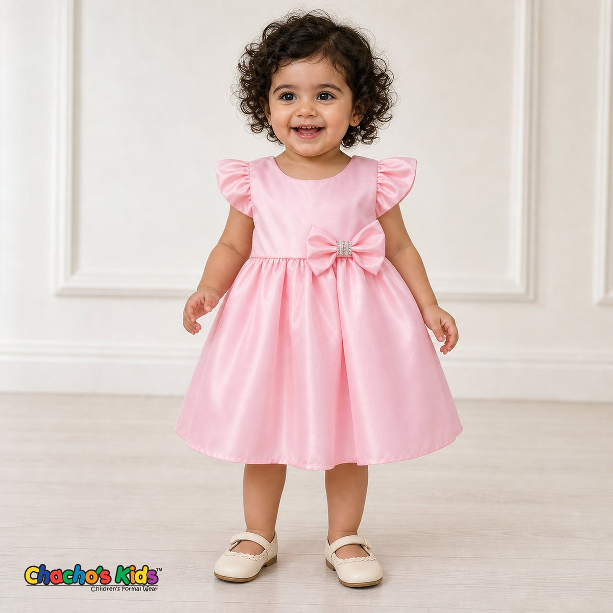 Baby girl wearing pink satin flower girl dress with flutter sleeves and bow, style B263