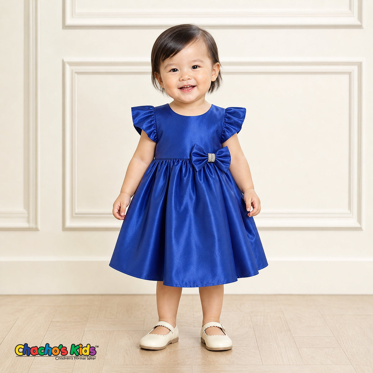Baby girl wearing royal blue satin flower girl dress with flutter sleeves and bow, style B263