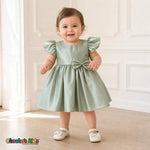 Baby girl wearing sage green satin flower girl dress with flutter sleeves and bow, style B263