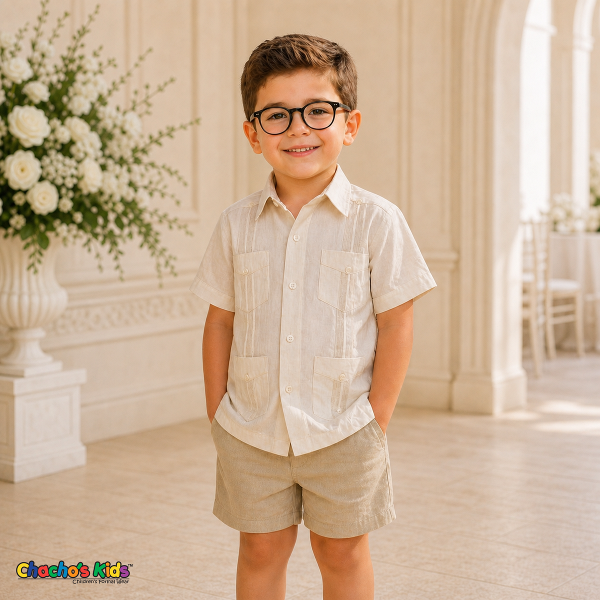 Young boy wearing champagne 100% linen classic guayabera with four pockets and coordinated linen shorts