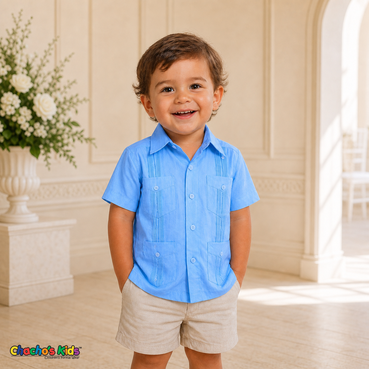 Toddler boy wearing light blue 100% linen classic guayabera with four pockets at a formal celebration