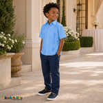 Young boy wearing light blue 100% linen classic guayabera with four pockets, three-quarter formal view