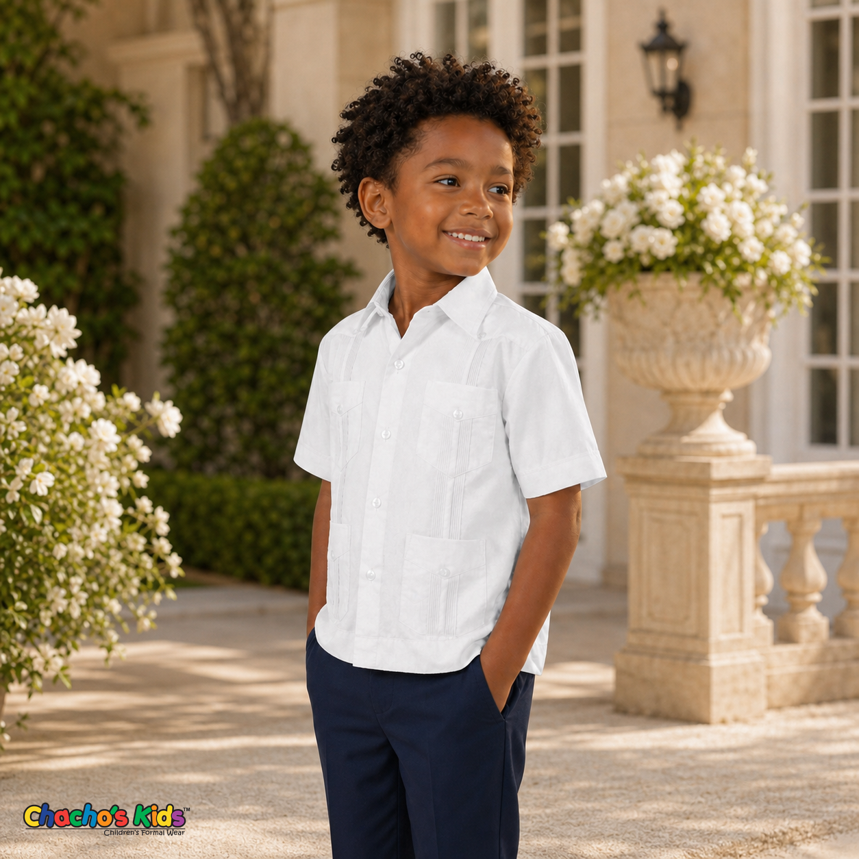 Young boy wearing white 100% linen classic guayabera with four pockets, three-quarter formal view