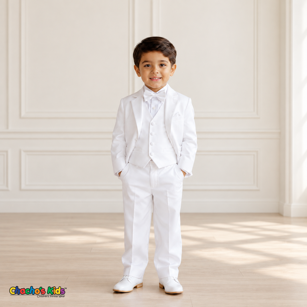 Boys Signature Tuxedo in White (BY010), younger child model in front view wearing the white tuxedo, vest and bow tie.