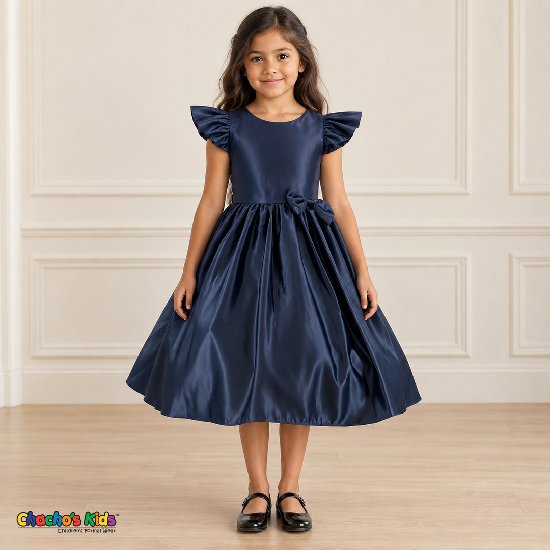 Front view of a girl wearing the navy blue satin flower girl dress, Style 263, with flutter sleeves, a small waist bow and a full gathered skirt.