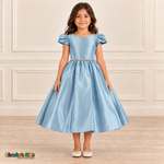 Front view of a girl wearing the light-blue satin party dress, style 436, with short puff sleeves, a sparkling waist and a full skirt.