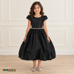 Front view of a girl wearing the black shimmer puff sleeve party dress, Style 444, with a jeweled waist and full gathered skirt.