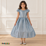 Front view of a girl wearing the light blue shimmer puff sleeve party dress, Style 444, with a jeweled waist and full gathered skirt.