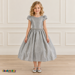 Front view of a girl wearing the silver shimmer puff sleeve party dress, Style 444, with a jeweled waist and full gathered skirt.