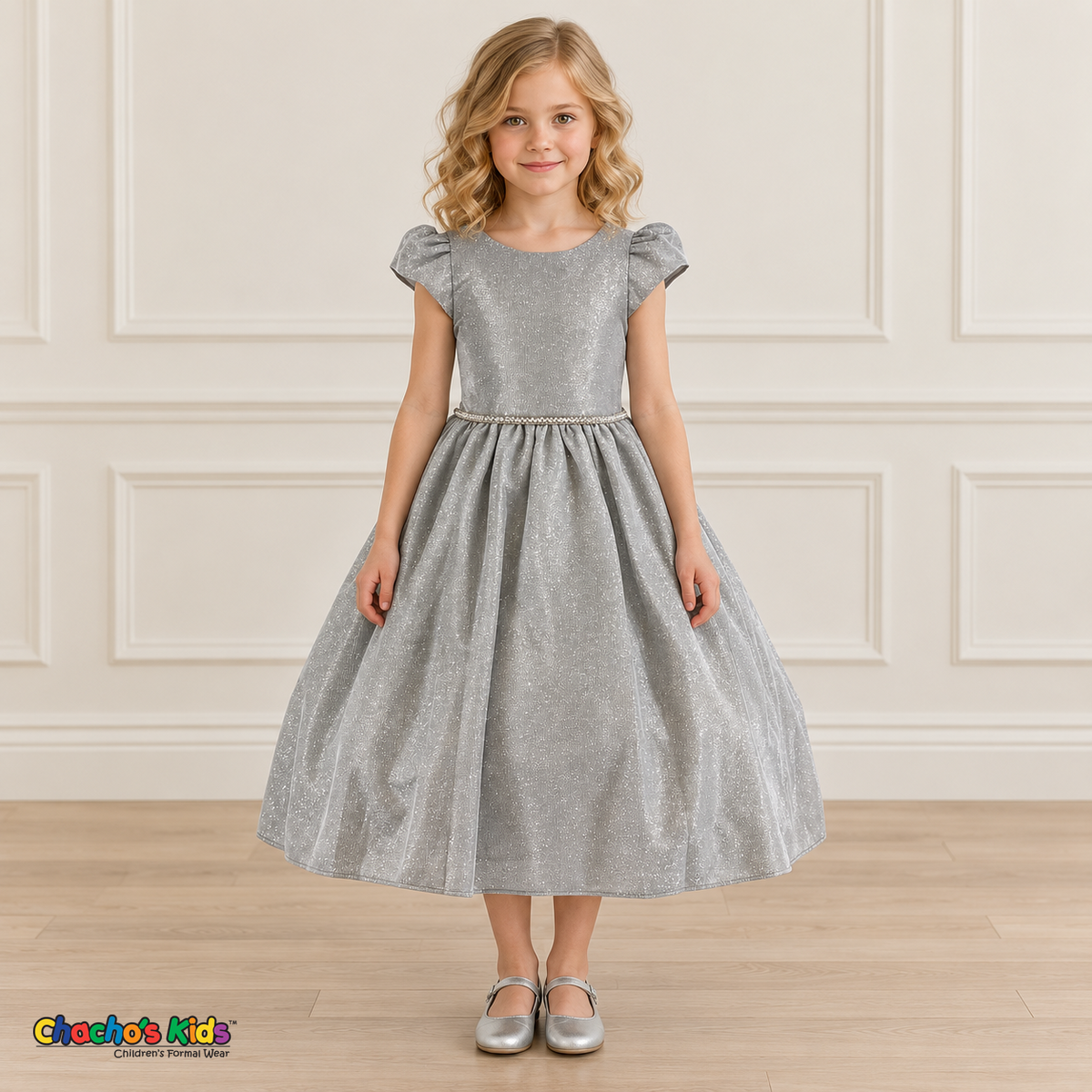 Front view of a girl wearing the silver shimmer puff sleeve party dress, Style 444, with a jeweled waist and full gathered skirt.