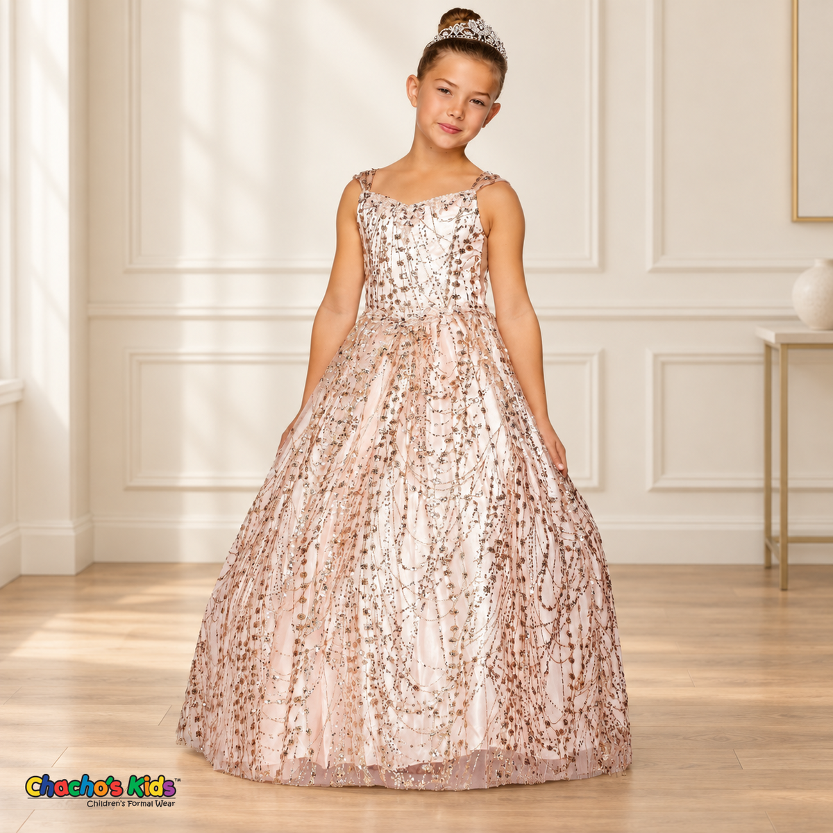 Girl wearing the Blush Glitter Sweetheart Ball Gown (8007), with floral sequins, jeweled trim and a full tulle skirt.