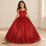Girl wearing the Red Glitter Sweetheart Ball Gown (8007), showing floral sequins, looping glitter garlands, sheer embellished straps and a full floor-length tulle skirt.