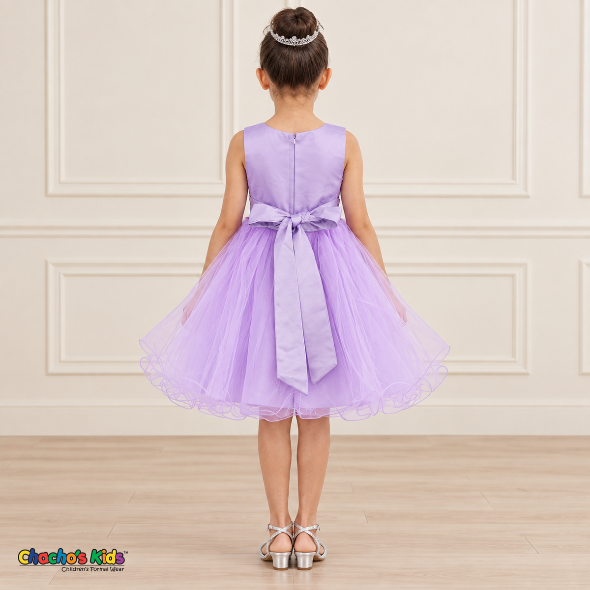 Back view of the lilac Style 9150 tulle dress on a girl, showing the zipper, matching satin bow, and layered curled hem.