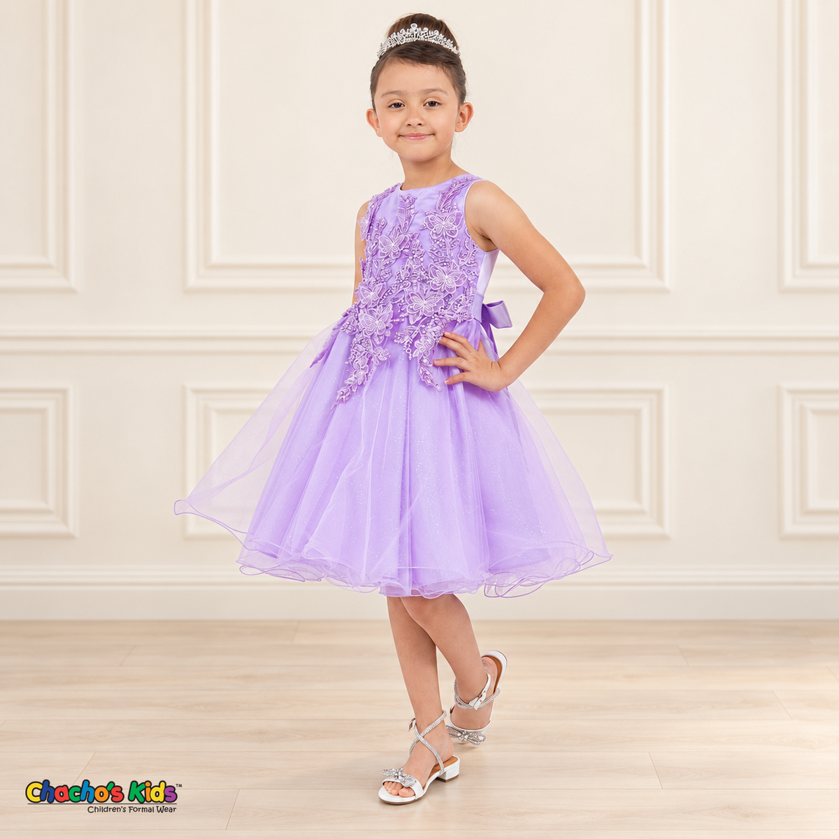 Side view of a girl wearing the lilac Style 9150 butterfly embroidered dress with a full layered tulle skirt.