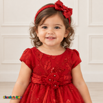 Baby girl wearing the Red Baby Floral Rosette Dress D-1664, embroidered bodice and matching bow headband detail.