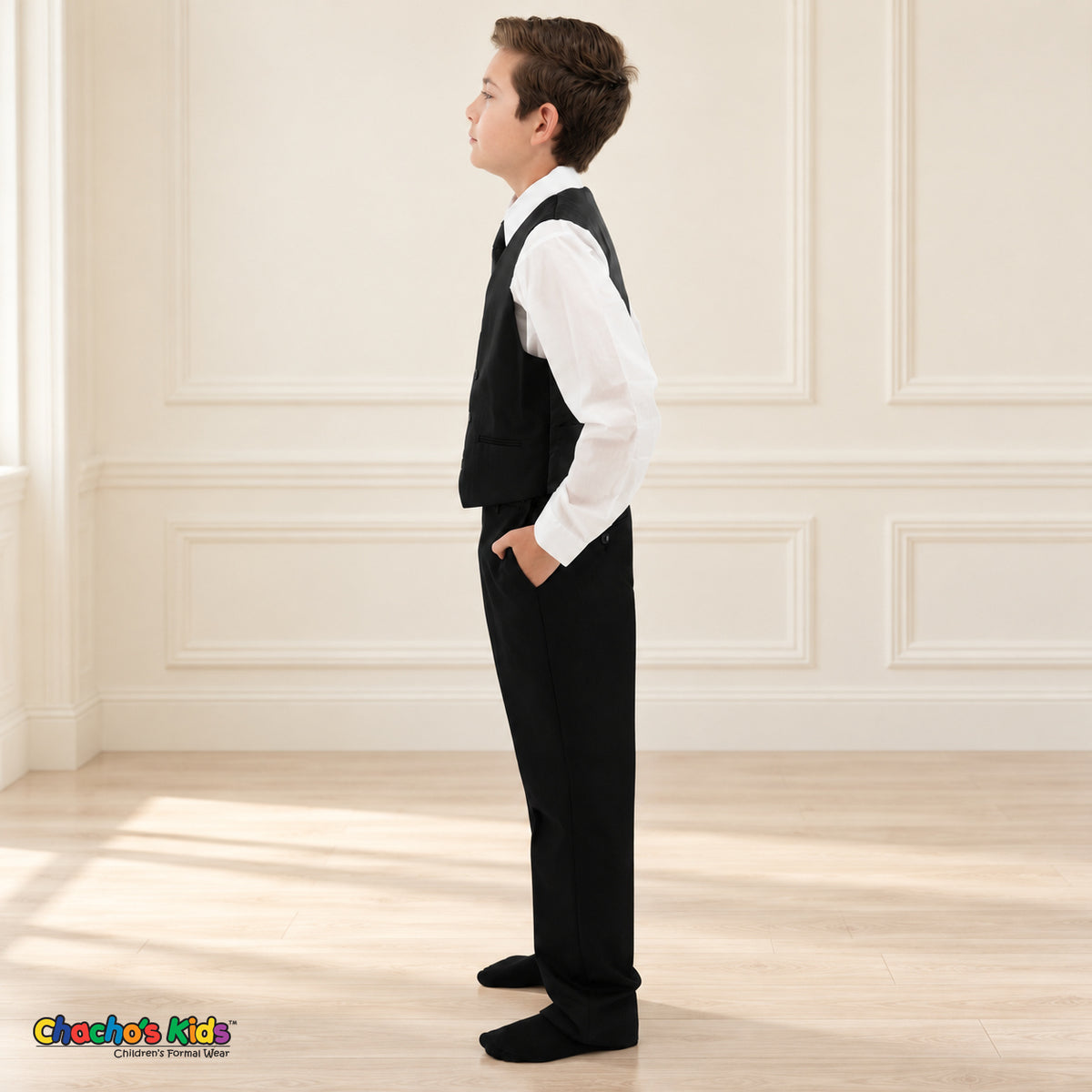 Black BJ4005 Executive boys suit on the existing child model without the coat, left side view of the vest, white shirt and matching trousers.