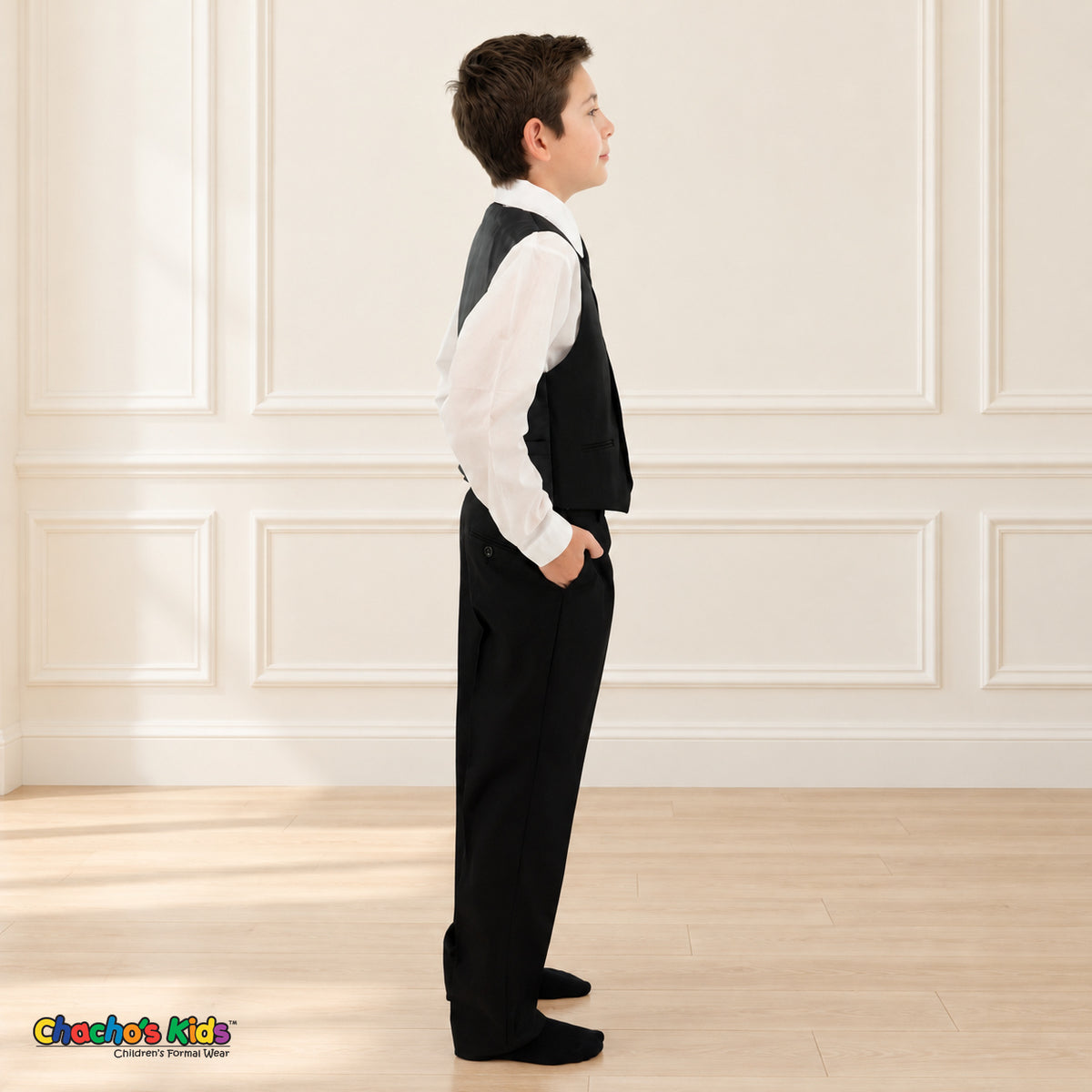 Black BJ4005 Executive boys suit on the existing child model without the coat, right side view of the vest, white shirt and matching trousers.