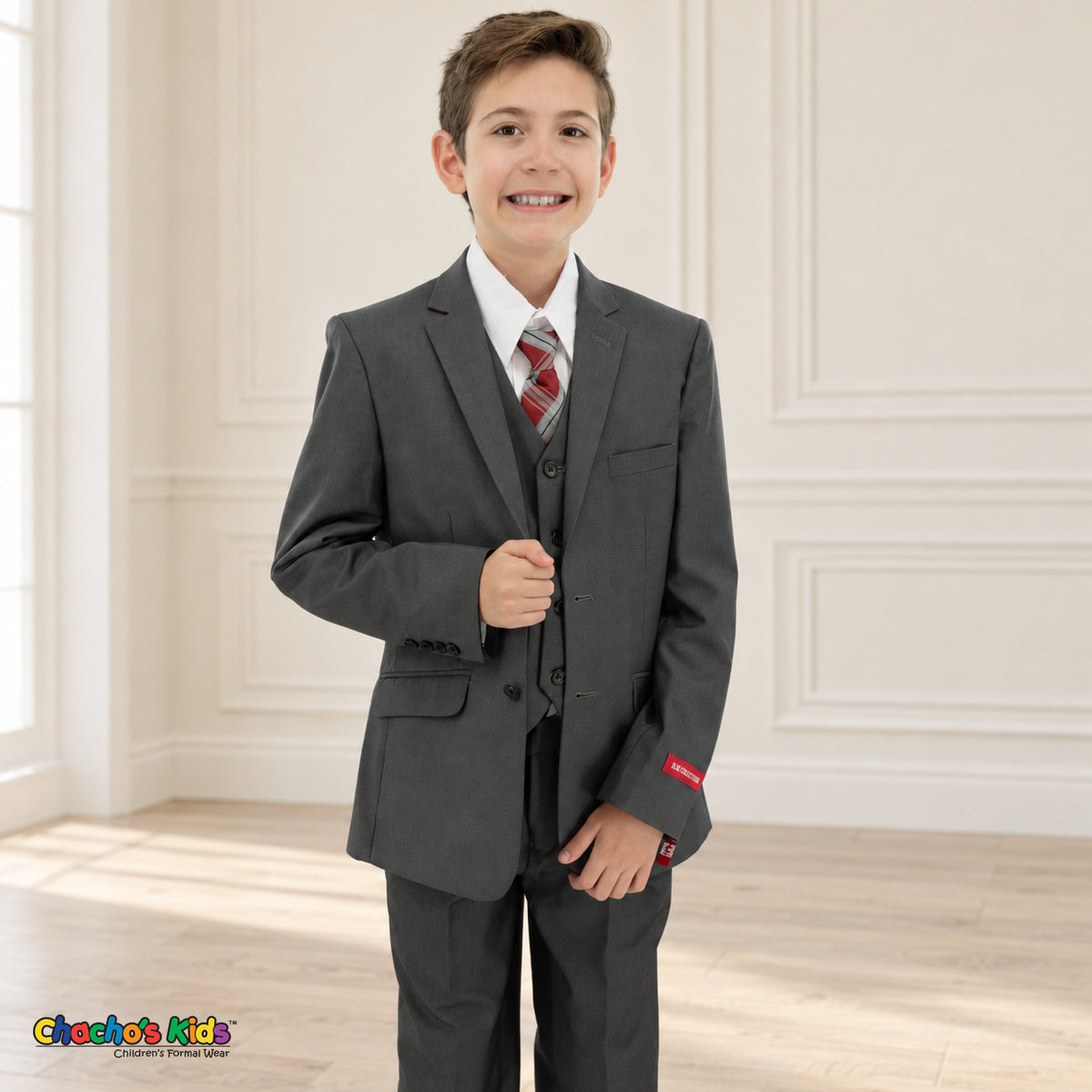 Charcoal Gray BJ4005 Premium Executive boys suit, front detail view, with matching coat and vest, white shirt and red-and-gray plaid tie.