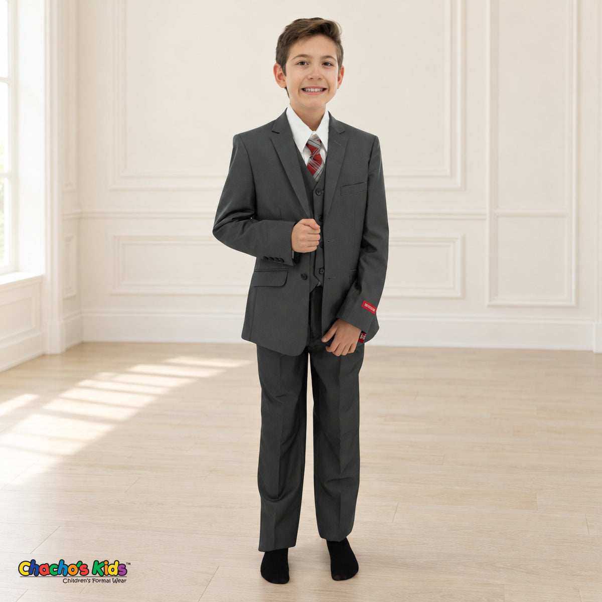 Charcoal Gray BJ4005 Premium Executive boys suit, front view, with matching coat and vest, white shirt and red-and-gray plaid tie.