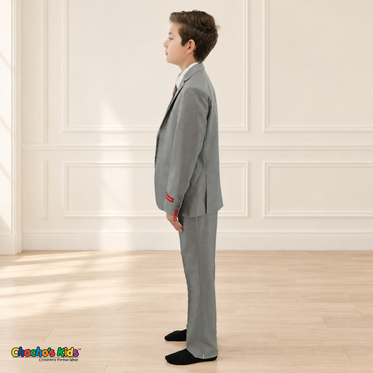 Gray BJ4005 Premium Executive boys suit, coat left side view showing the coat and matching trousers with a white shirt.