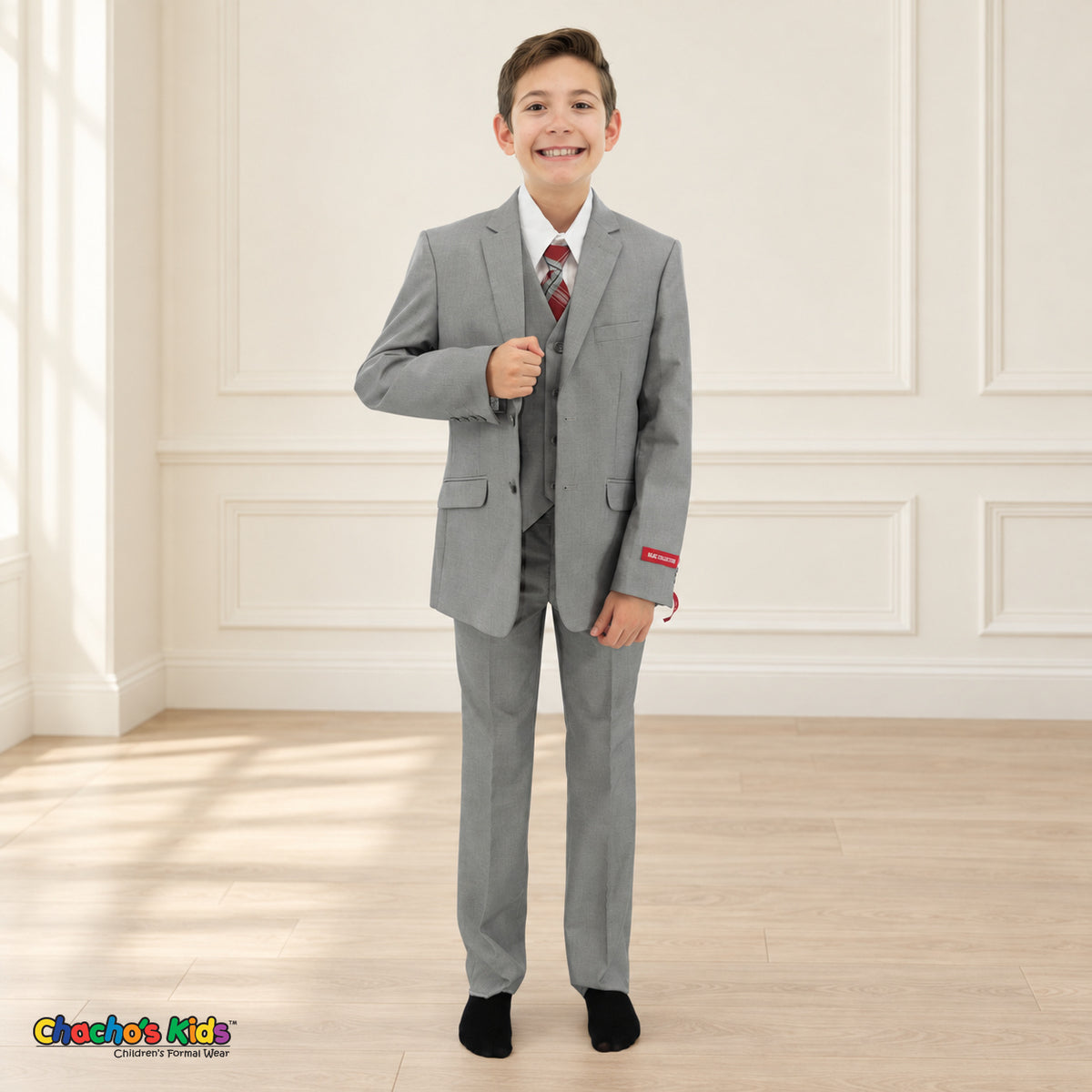 Gray BJ4005 Premium Executive boys suit, front alternate view, with matching coat and vest, white shirt and red-and-gray plaid tie.