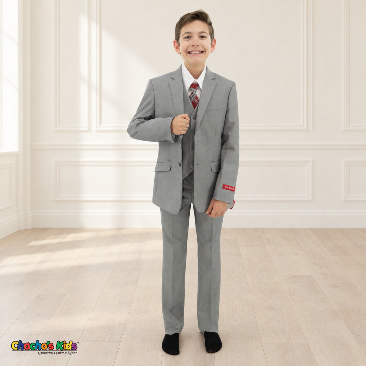 Gray BJ4005 Premium Executive boys suit, front view, with matching coat and vest, white shirt and red-and-gray plaid tie.