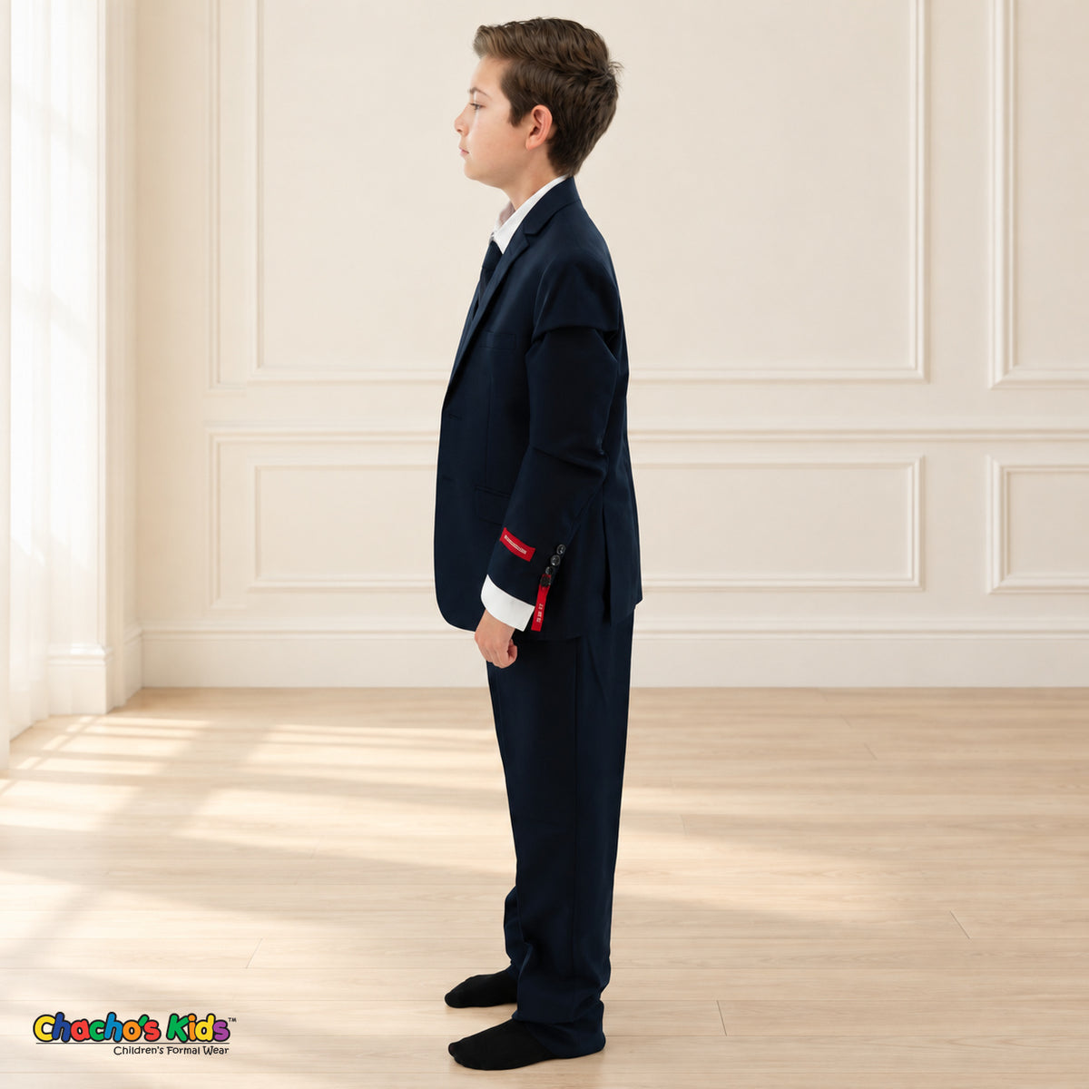 Navy Blue BJ4005 Premium Executive boys suit, coat left side view showing the jacket and matching trousers.