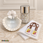White floral baptism shell, clear-bead rosary jar, white handkerchief and unpackaged scapular.