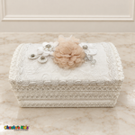 Long white baptism keepsake chest with champagne and white flowers, pearl accents and decorative lace.