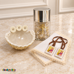 Natural baptism shell, gold-tone rosary in a silver-capped jar, ivory handkerchief and brown-ribbon scapular