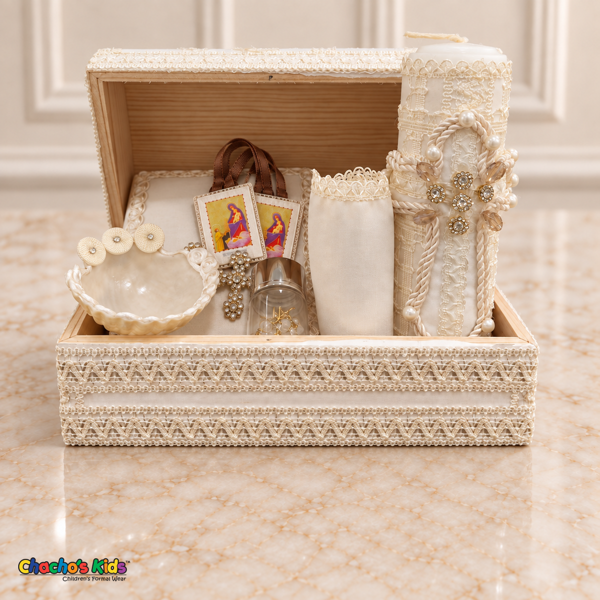 Cream ivory seven-piece baptism chest set with candle, Bible, shell, gold-tone rosary, handkerchief and unbagged scapular arranged inside the open wooden chest