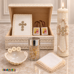 Cream ivory baptism chest set with tall lit pearl and crystal candle, Bible and scapular inside the chest, shell, gold-tone rosary in jar and handkerchief