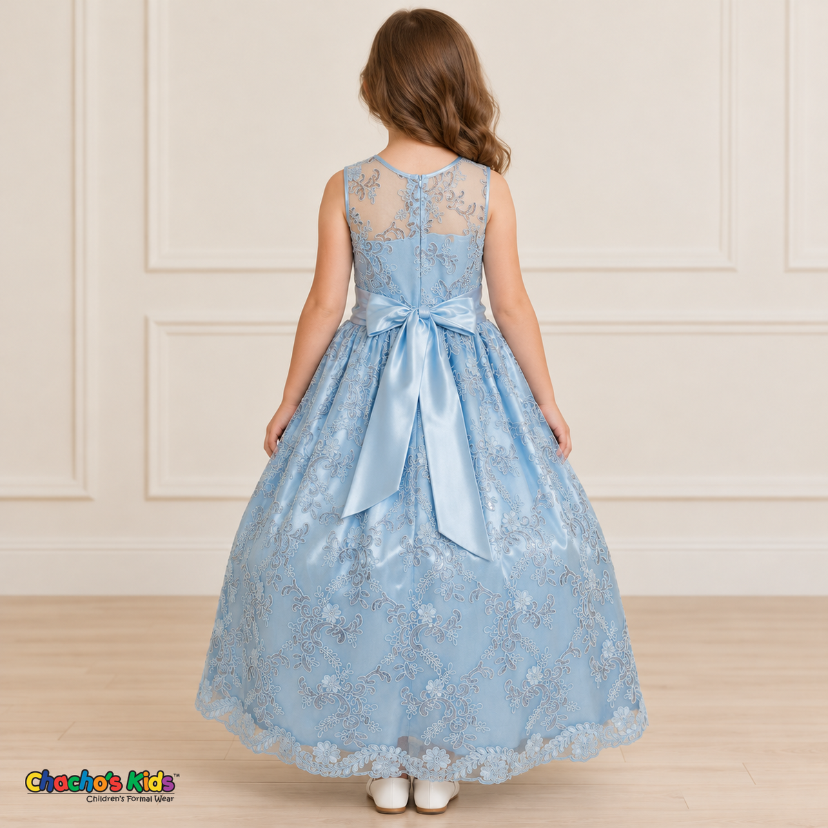 Girl wearing the Baby Blue Floral Embroidered Dress, Style D1550, back view, showing the embroidered sheer back, zipper and satin bow.